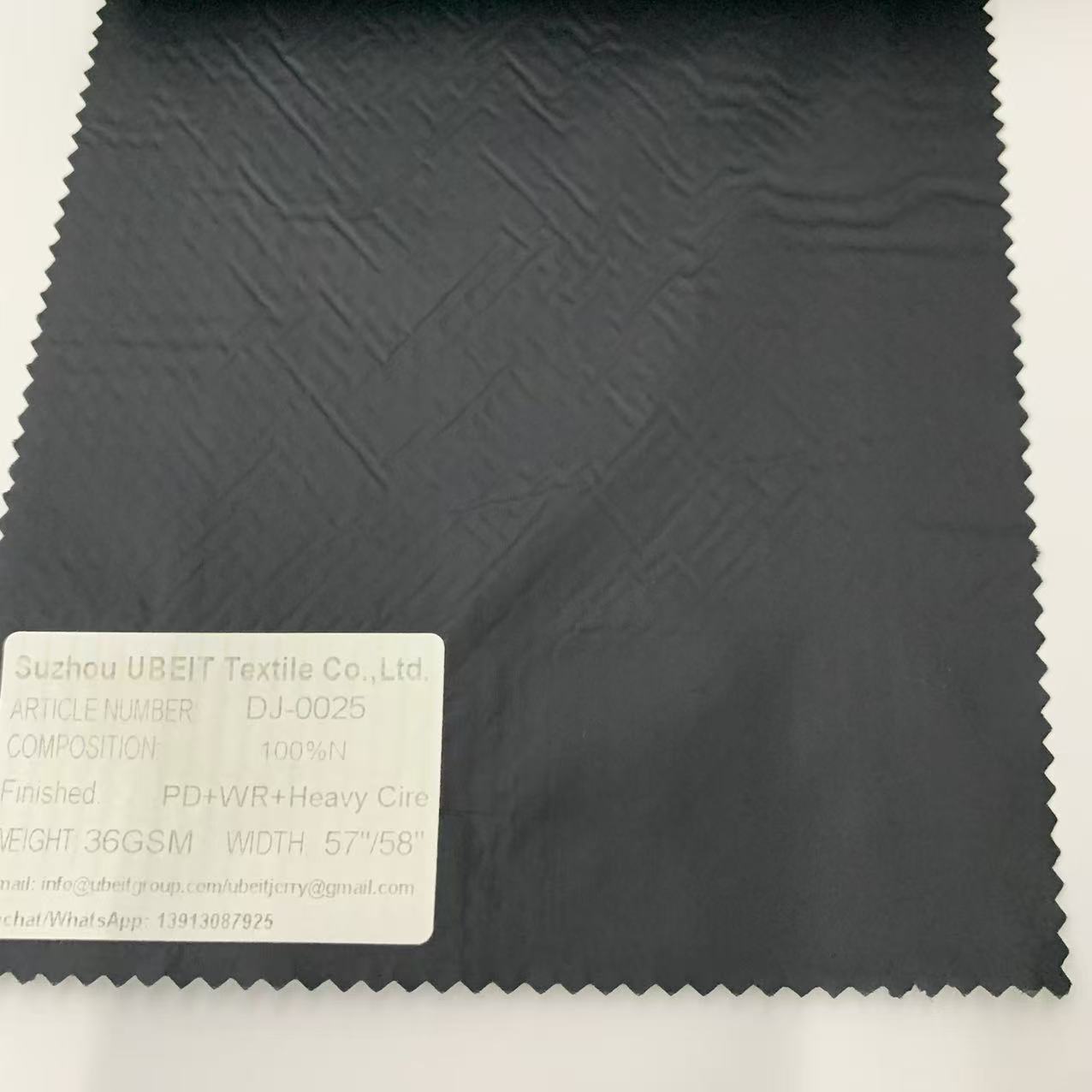 DJ-0025 100%N PD+WR+Heavy Cire Fabric